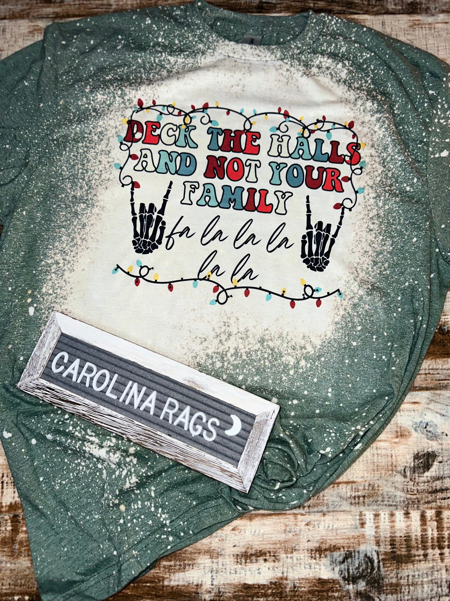 Deck The Halls and not Your Family olive green bleached tee